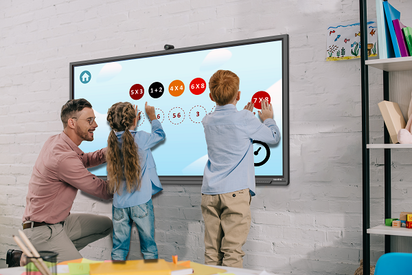 children using an interactive panel